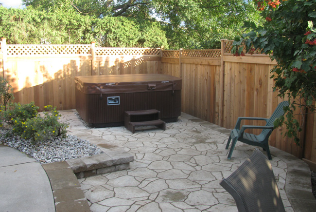 backyard stone walkway to hot tub