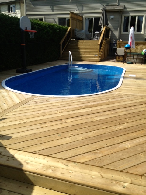 backyard wooden deck around pool