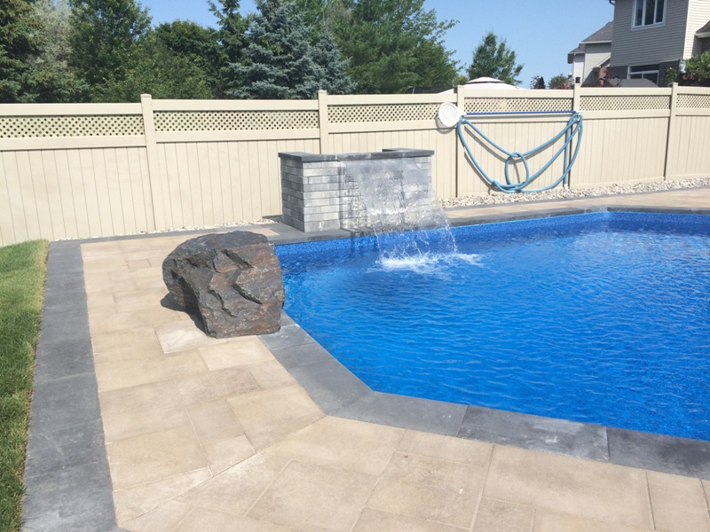 backyard pool waterfall stone design