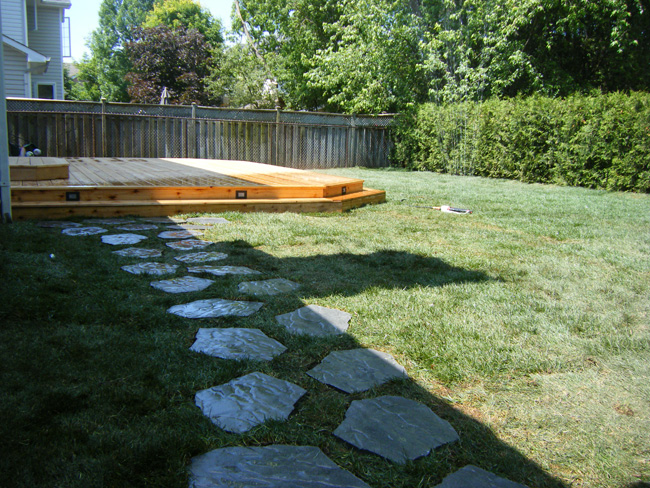 backyard stone walkway to deck