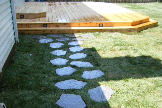 backyard stone walkway to deck