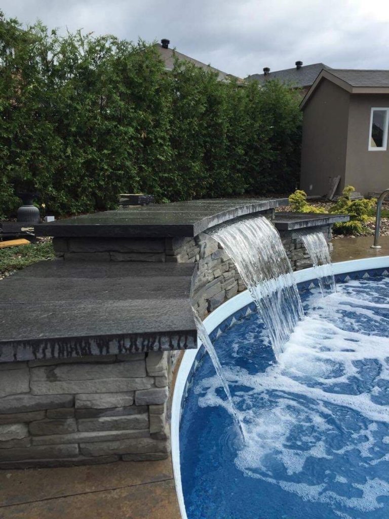 stone waterfall into pool